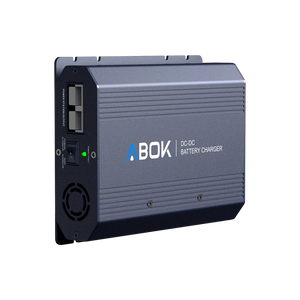 ABOK ACS500 DC-DC battery charger in an angled view showing the output ports, selector switch, LED, and cooling fan.