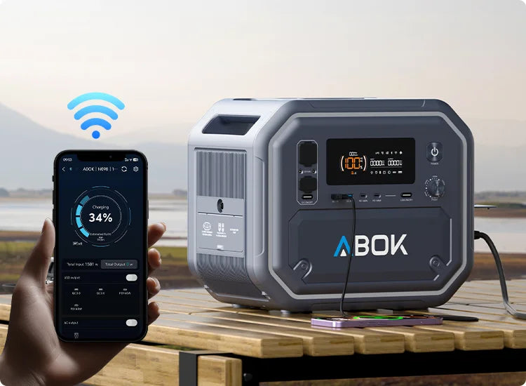 ABOK Ark2500 mobile outdoor scene showing smartphone app monitoring while the portable power station powers campsite devices