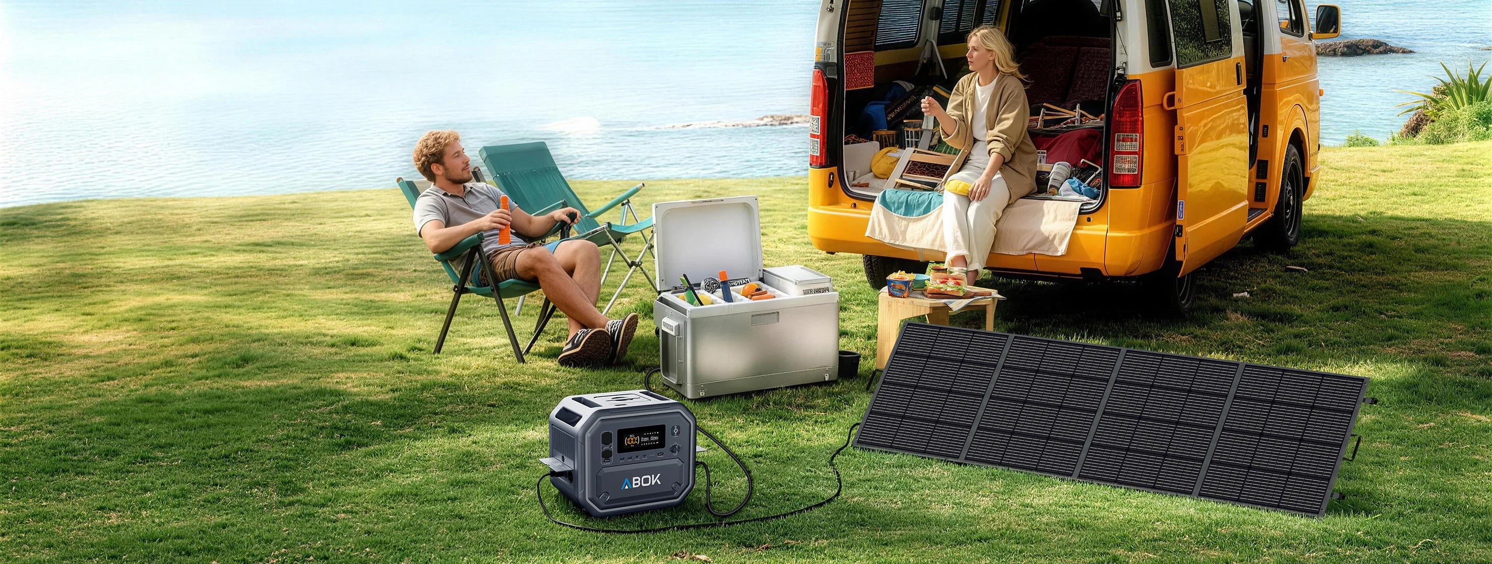 ABOK Ark2500 wide seaside camping scene with the portable power station connected to a foldable solar panel beside a camper van