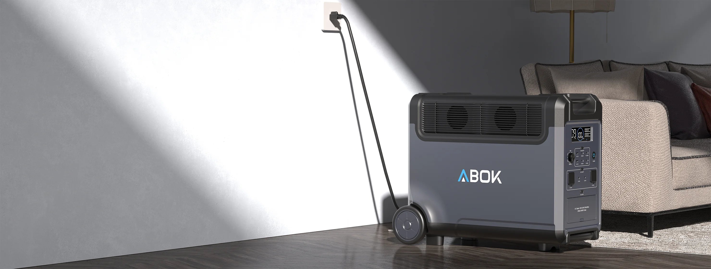 ABOK Ark3600 portable power station beside a sofa and wall outlet in a modern living room banner