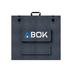 ABOK ASP200 foldable 200W solar panel shown closed from the rear with carry handle, buckles, and cable pouch.