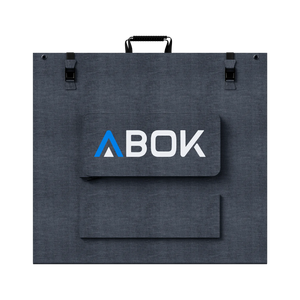 ABOK ASP400 foldable 400W solar panel shown closed from the rear with carry handle, buckles, and cable pouch.
